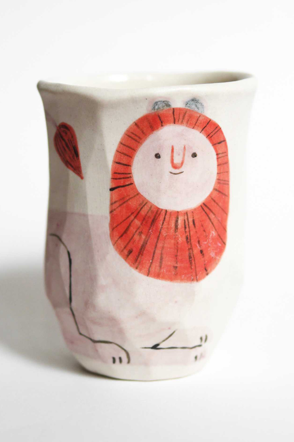 Ceramic cup with an illustrated lion by Two Holds Studio