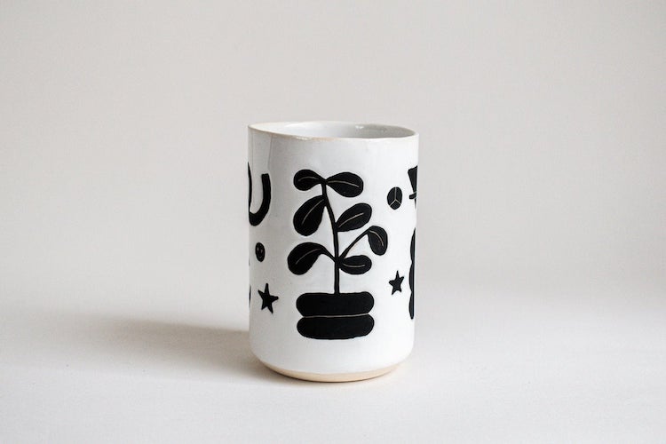 Illustrated ceramic cup