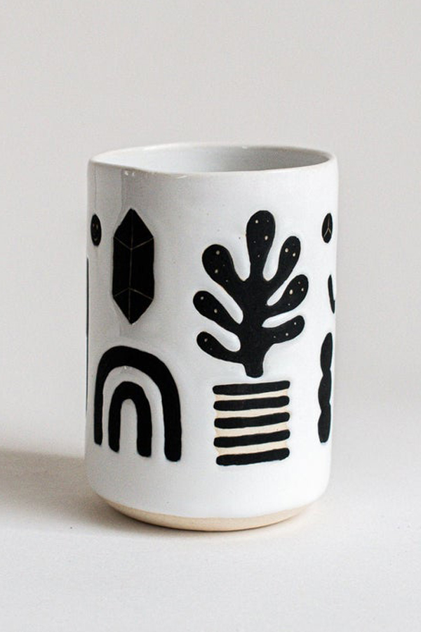 Illustrated ceramic cup