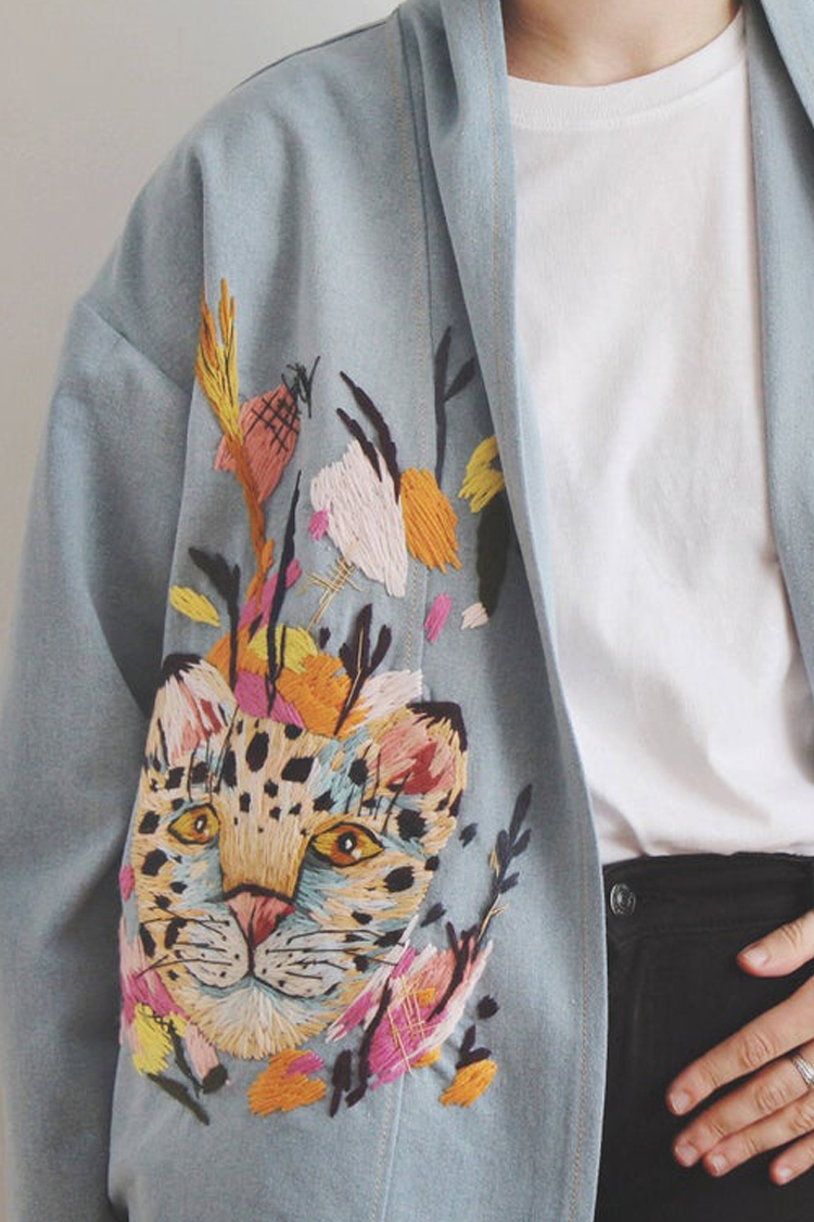 Embroidered jacket with leopard on it