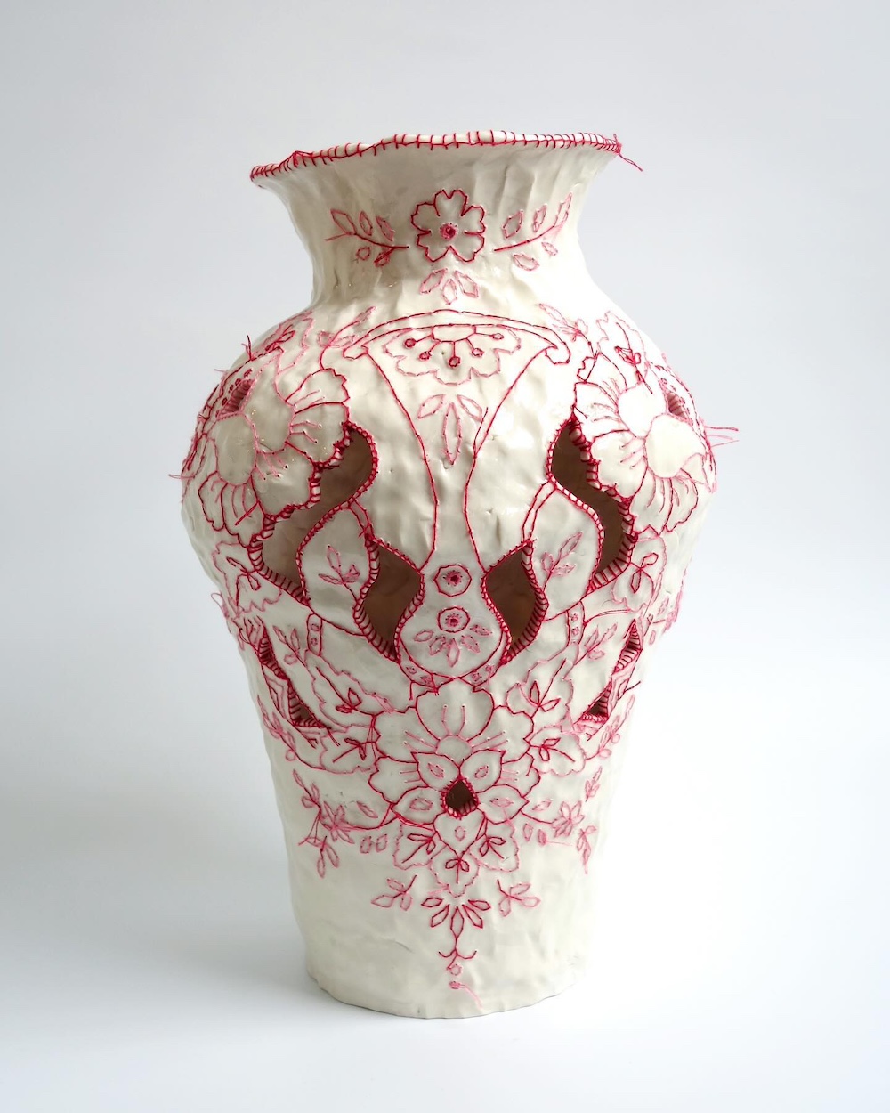 Embroidery on ceramic vase by Caroline Harrius