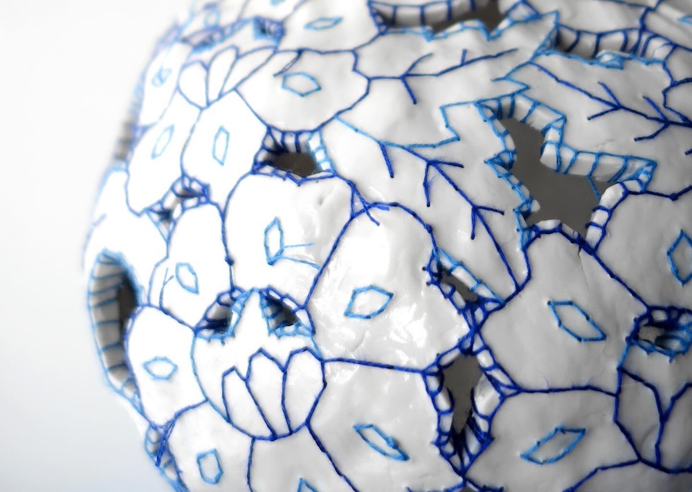 Embroidery on ceramic vase by Caroline Harrius